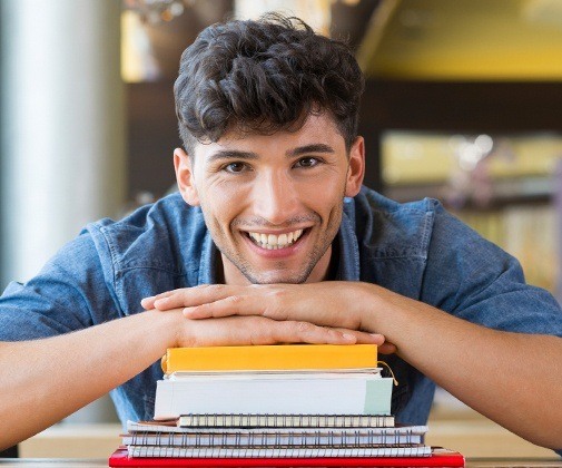 Young man smiling after wisdom tooth removal