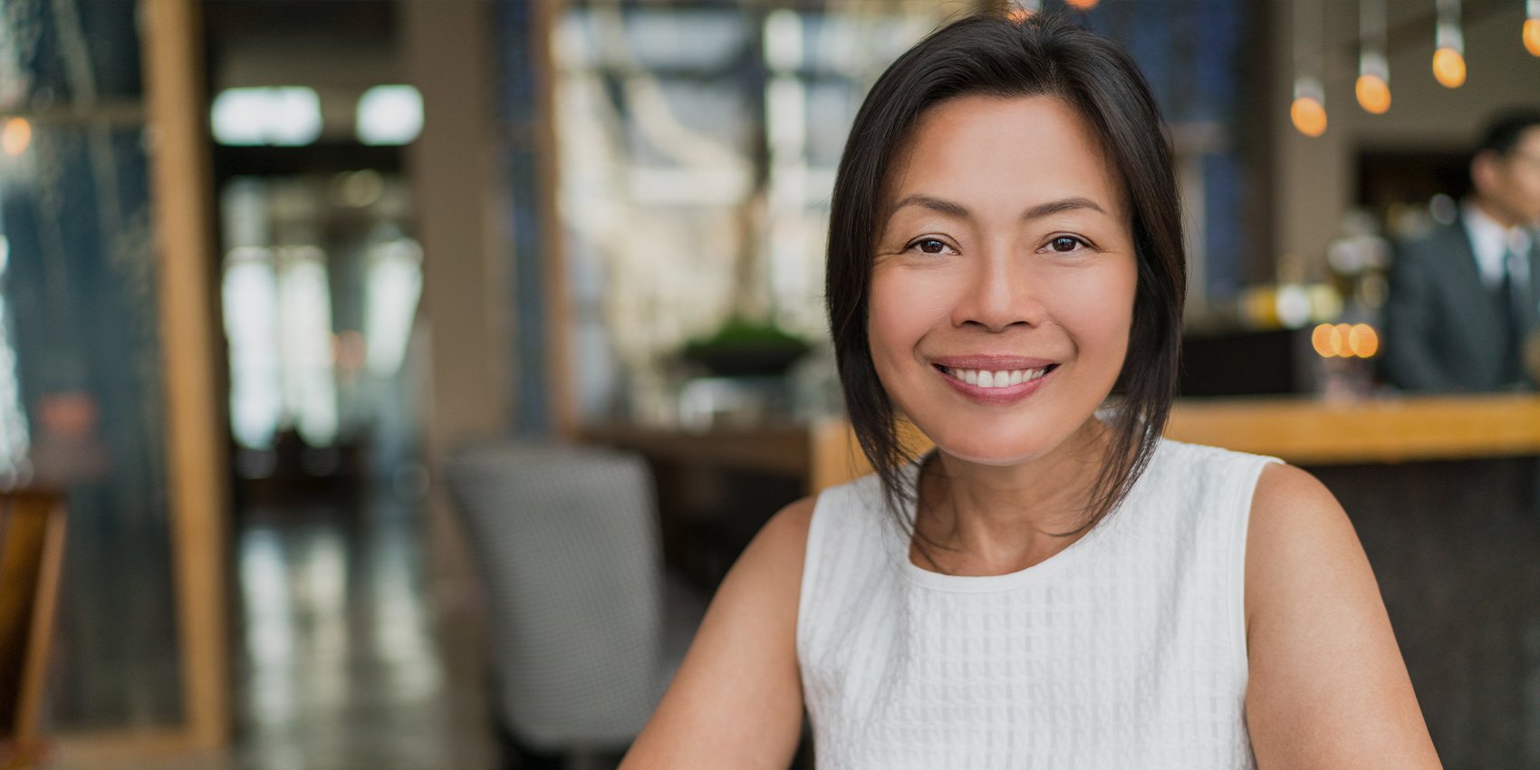 Older woman with a flawless smile after wisdom tooth extraction