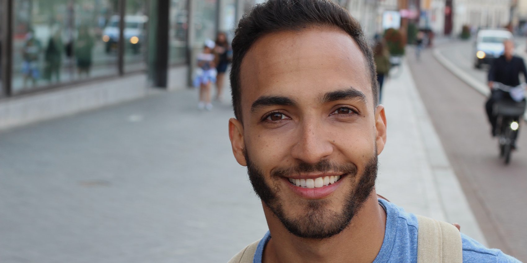 Young man with a healthy smile during wisdom tooth extraction