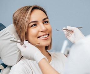 Woman receiving postoperative exam