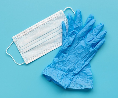 Set of blue plastic gloves and face masks