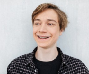 Teen with braces smiling